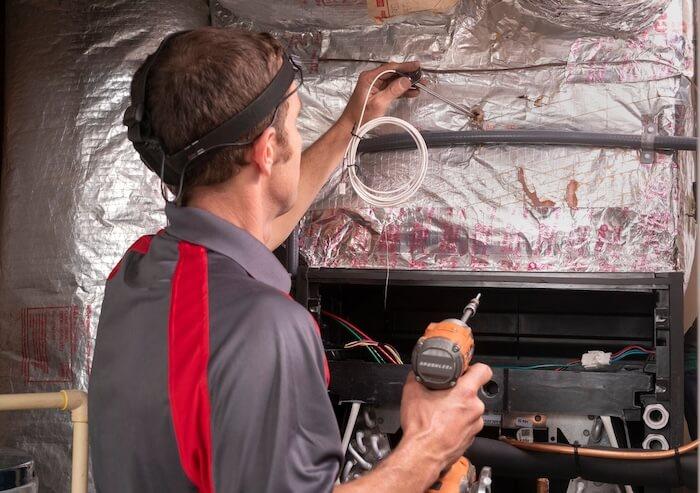 Man fixing an HVAC system