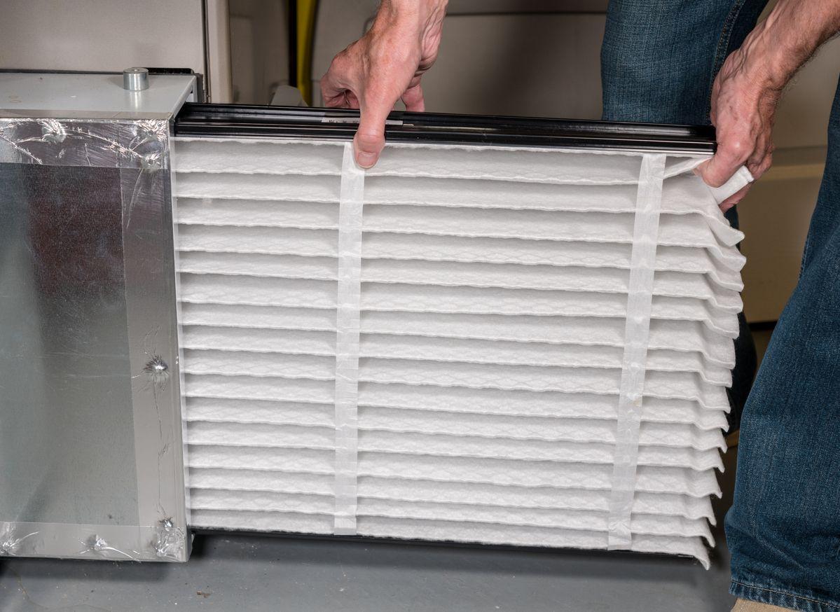 Man changing HVAC air filter